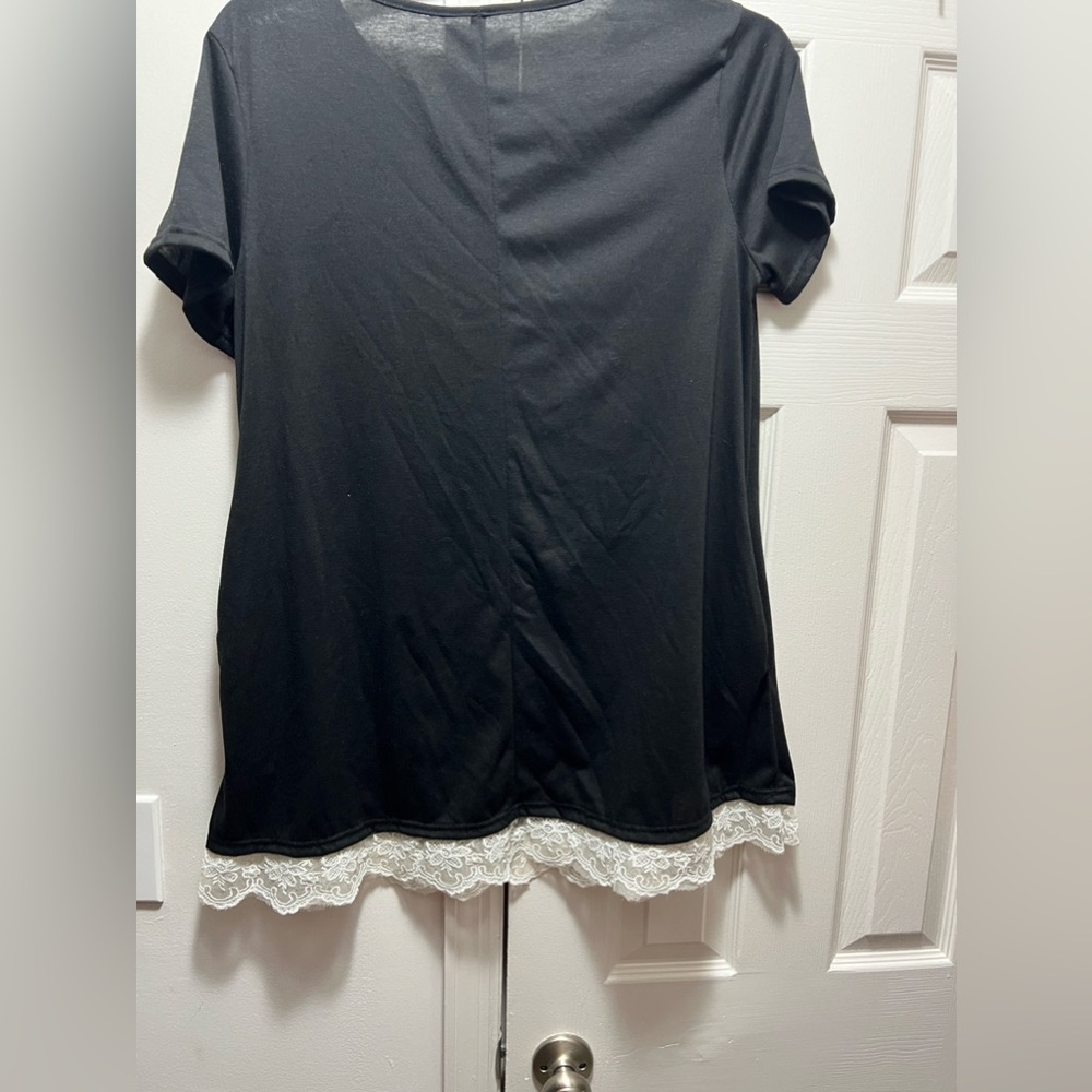 Black/white long blouse with scooped neck.